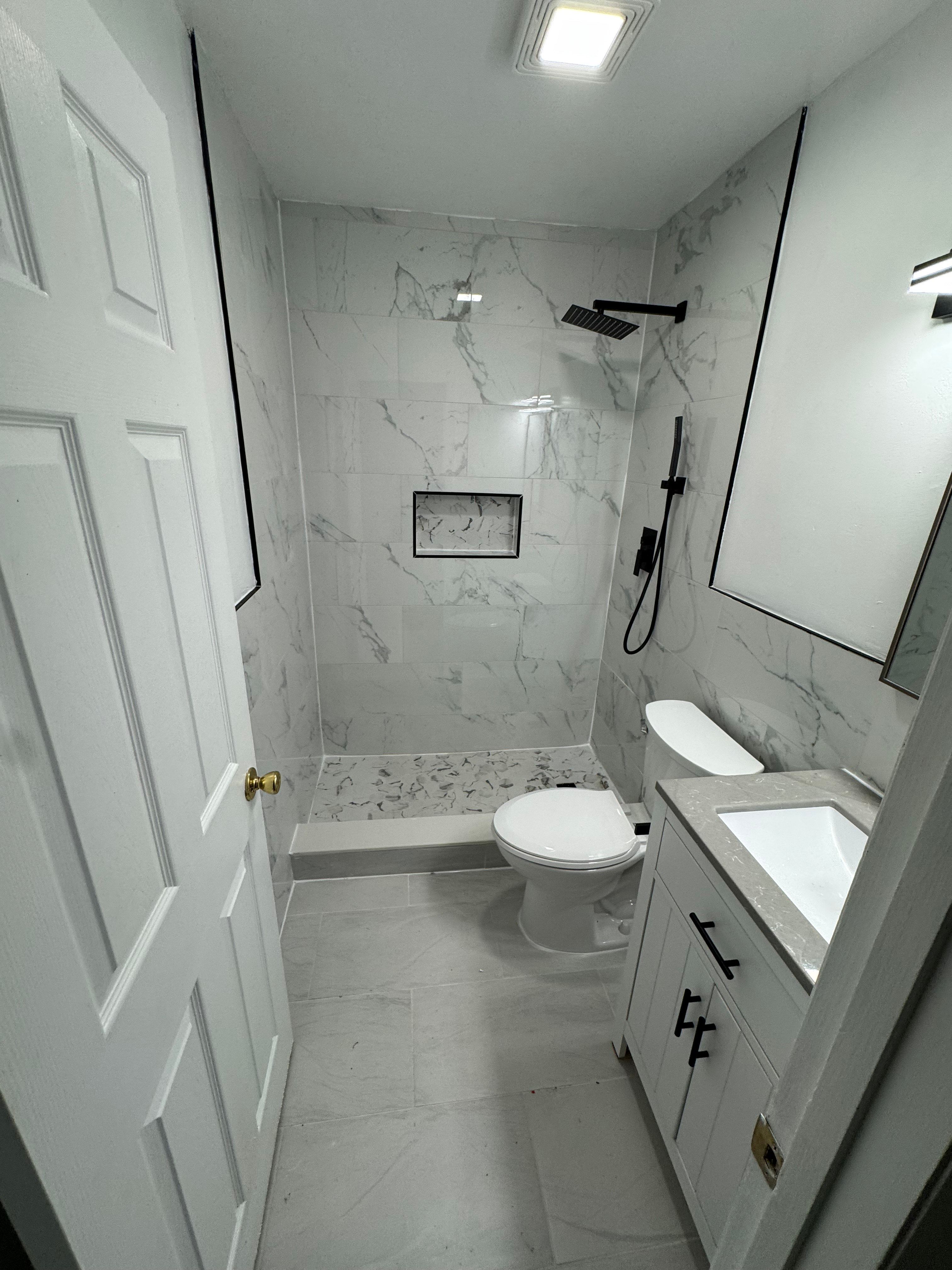 Worn primary bath, fully gutted — after